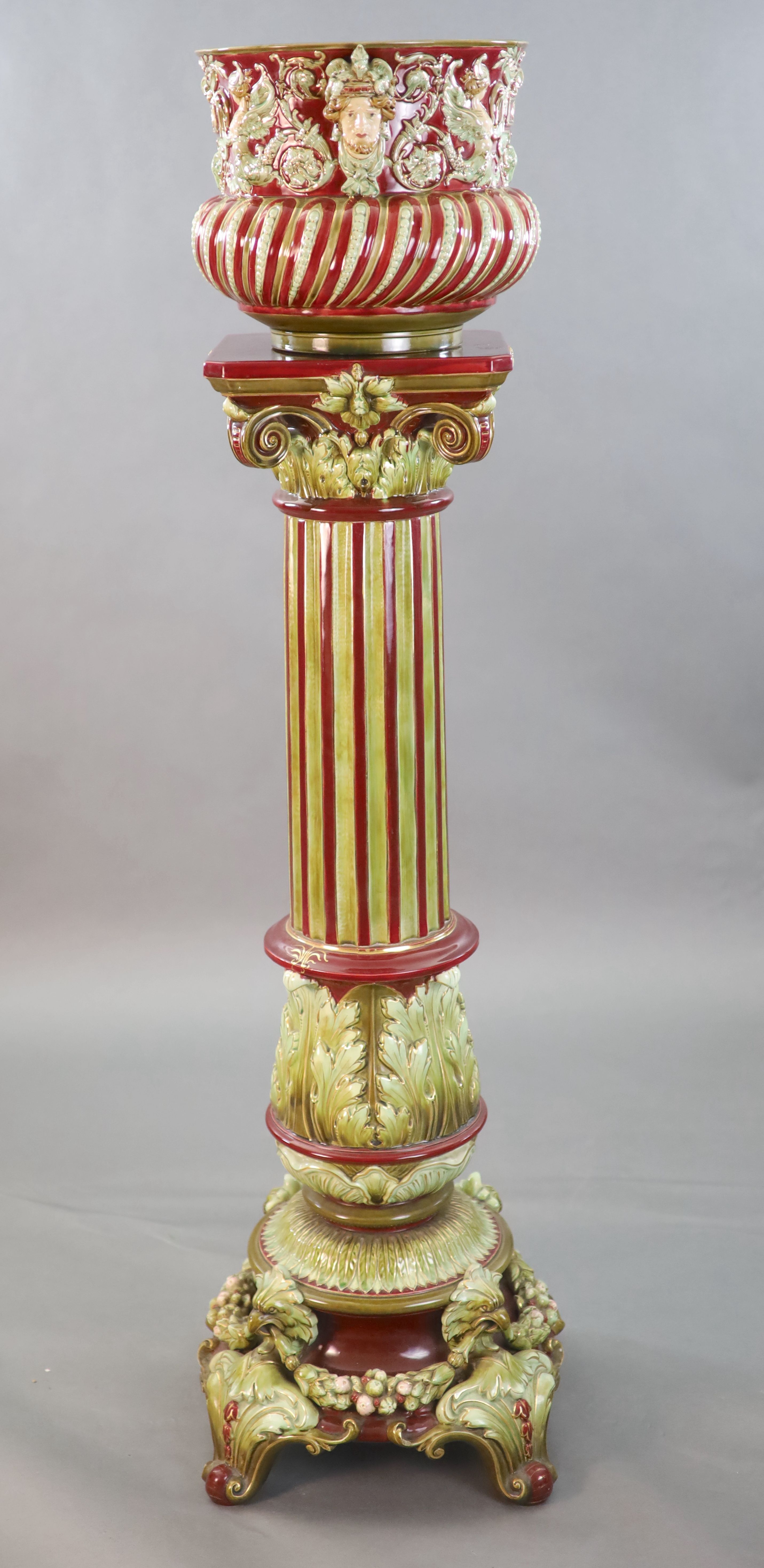 A Continental Baroque revival polychrome earthenware jardiniere and pedestal, c.1905, total height 149.5cm